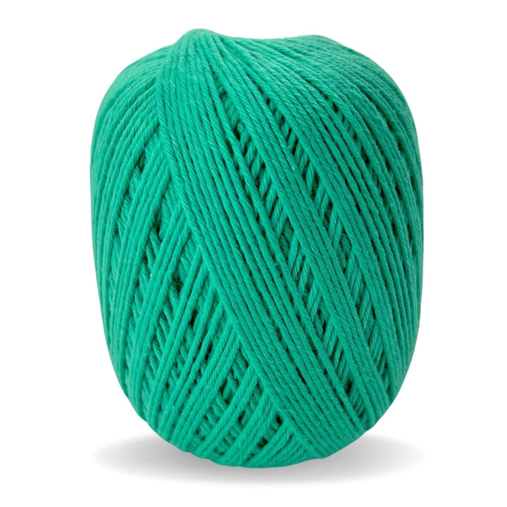 Teal cotton yarn in front of a white background.