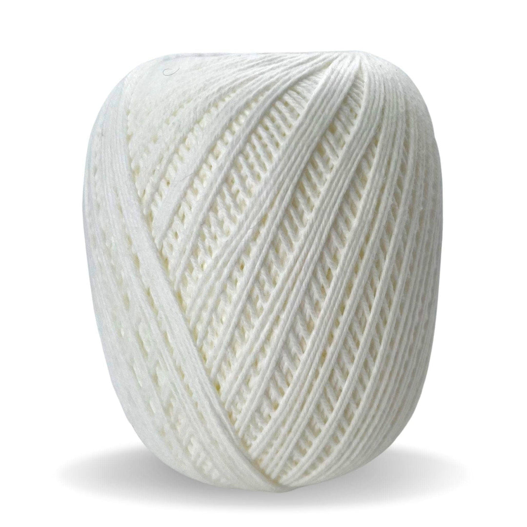 skein of white cotton yarn in front of a white background.