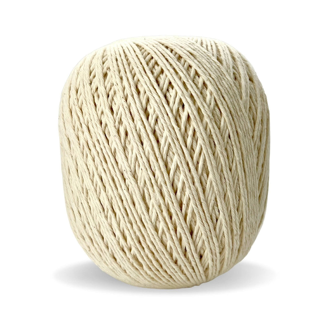 Skein of circulo natural cotton 4/8 (undyed) in front of a white background.