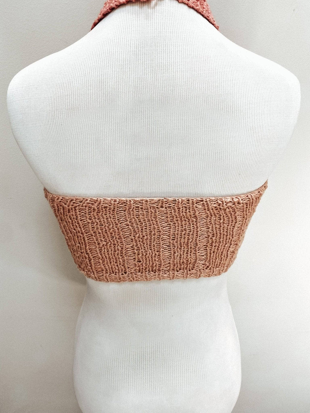 back view of mannequin wearing coconut tree pink knit bralette top.