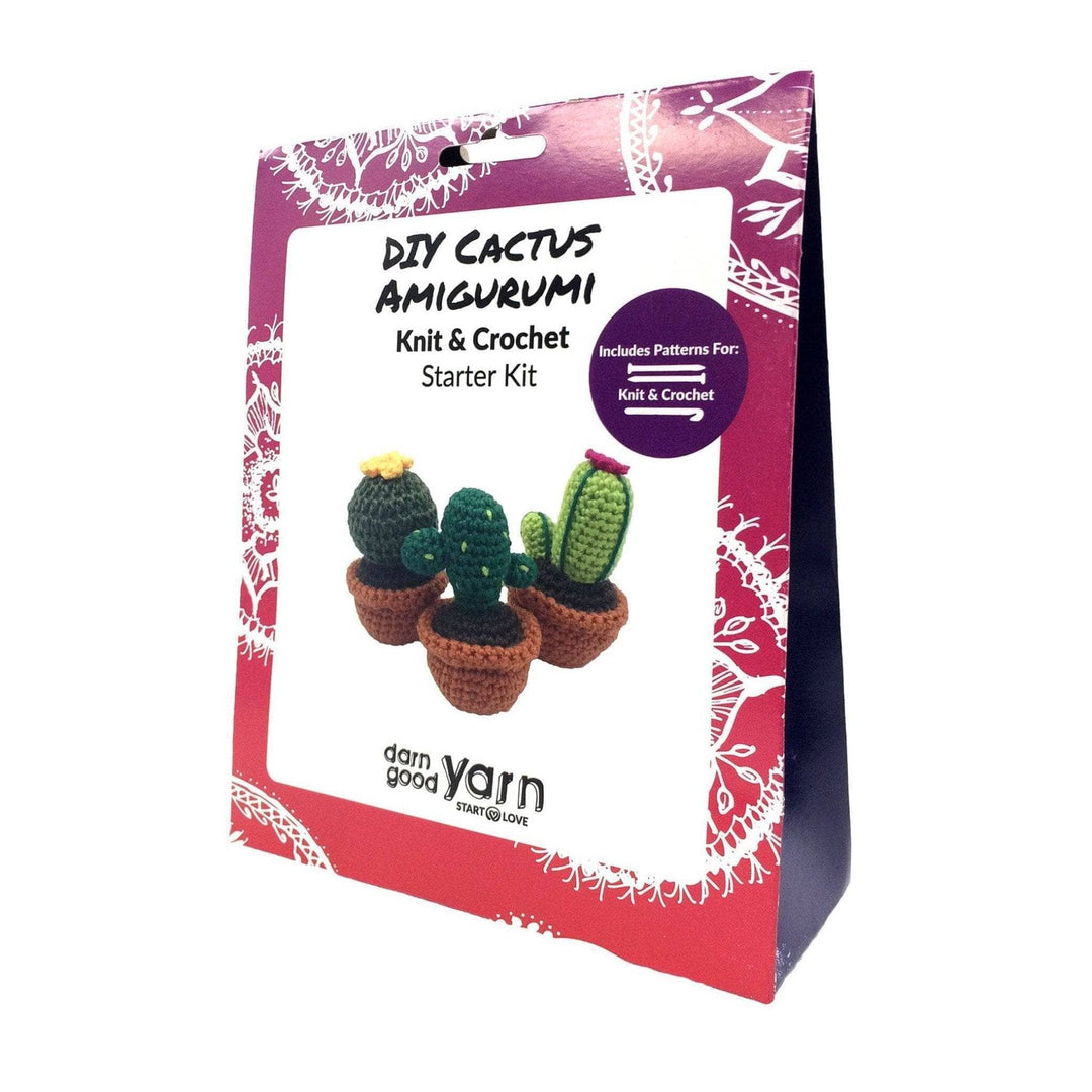 Triangular pink package with image of cactus amigurumi kit and words that read 'DIY Cactus Amigurumi Knit & Crochet Starter Kit'