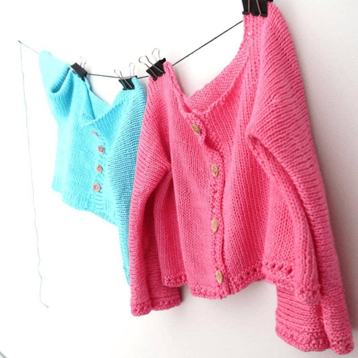 Blue and pink Baby Cardigan on a white background 