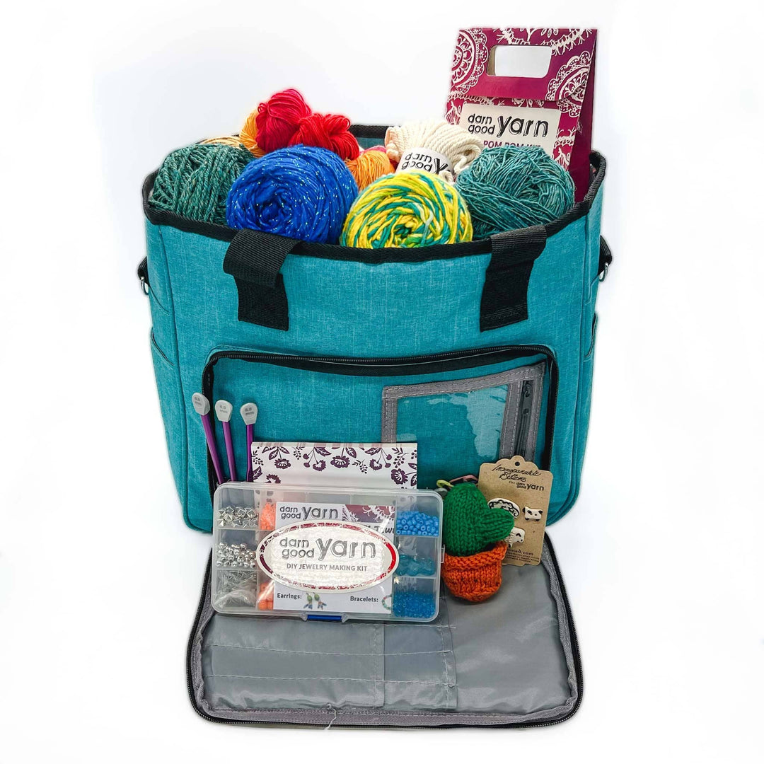 Crafters Deluxe Storage Bag Bundle in teal is on a white background with contents of the bundle inside.