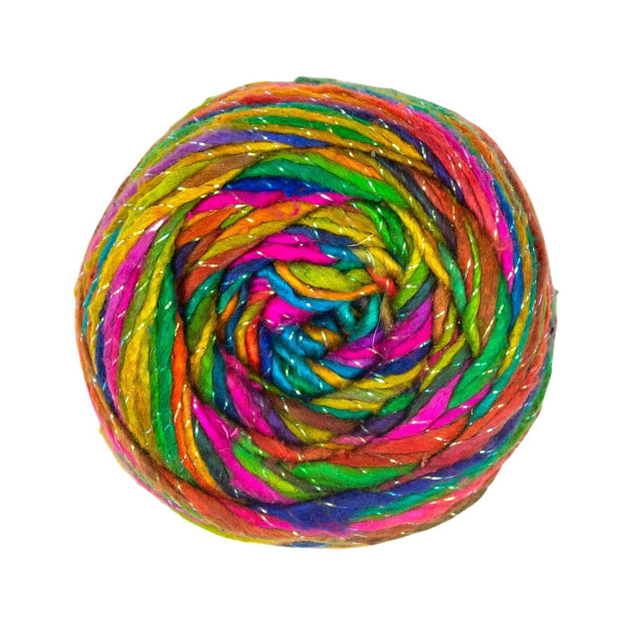 Sparkle variegated rainbow worsted weight silk yarn in front of a white background.