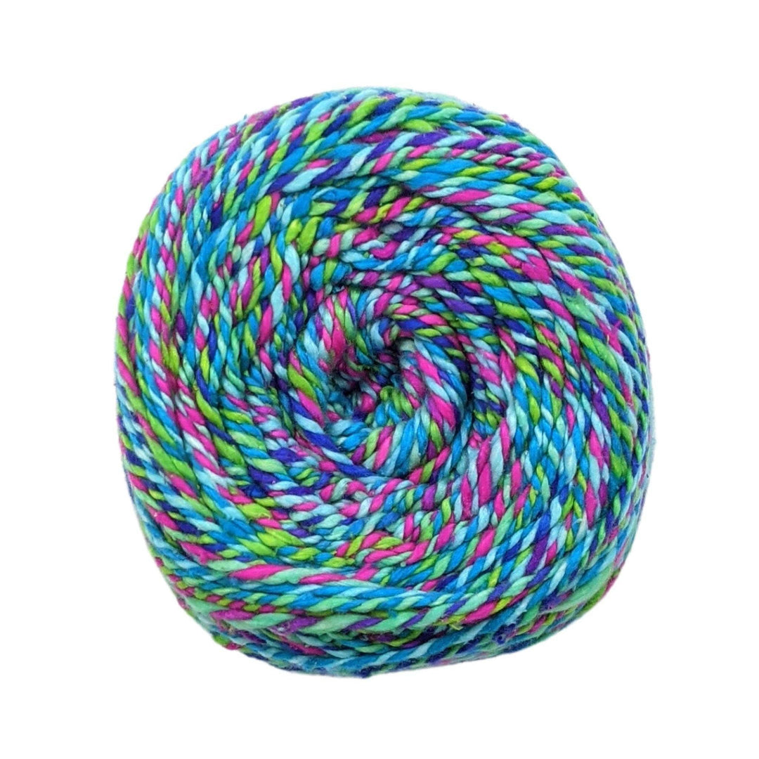 A skein of Darn Good Twist Sport Weight Silk yarn in the colorway 'Crocodile Snap'