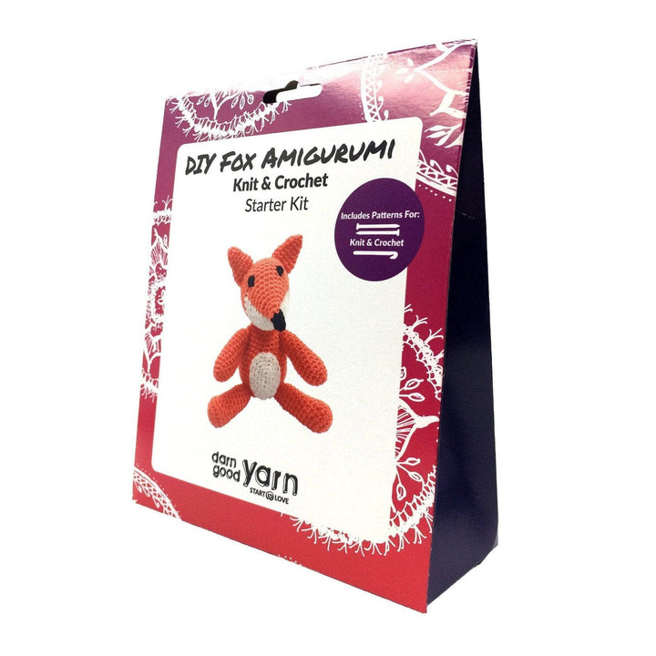 Triangular shaped purple cardstock product box with fox amigurumi kit images on the front