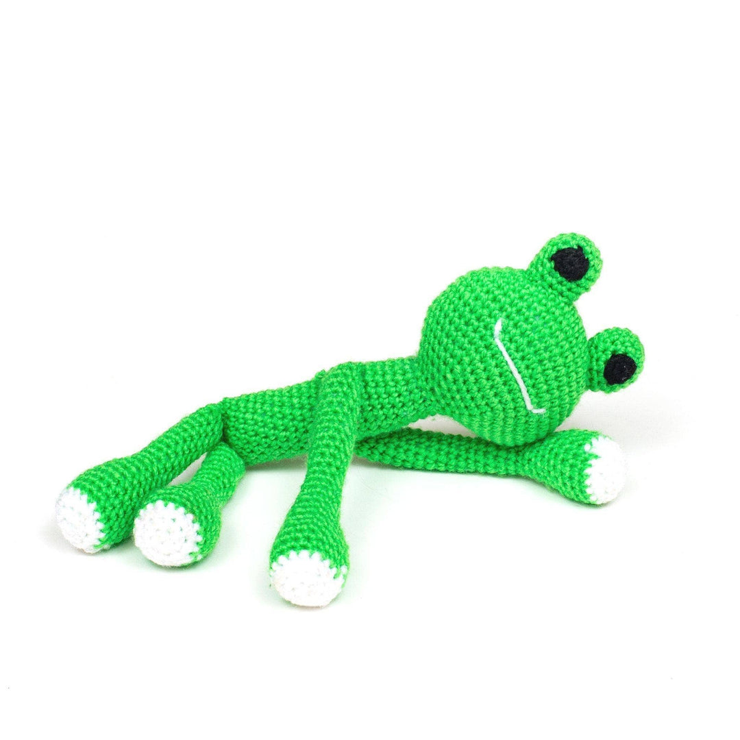 bright green amigurumi frog laying down in front of a white background.