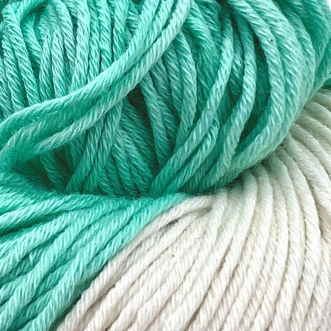 Detailed picture of Turquoise and white yarn on a white background. DK Weight Cotton Blend Yarn