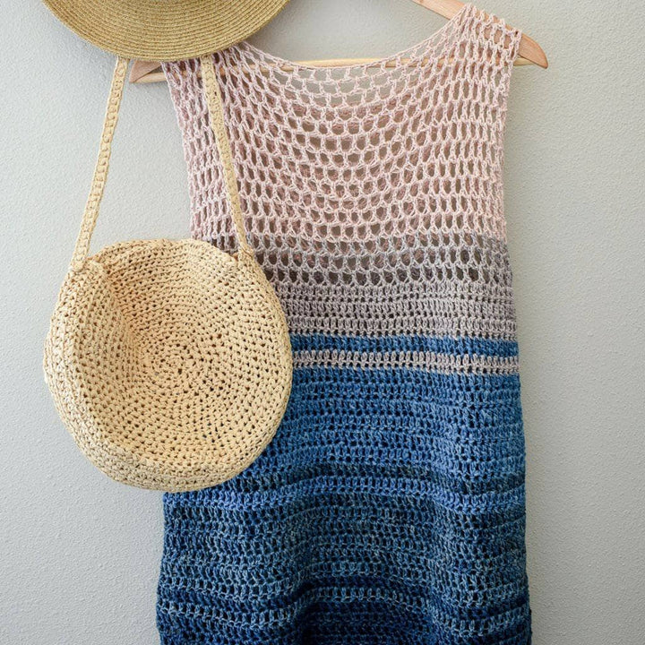 Easy Breezy Top Crochet Kit hanging over a white wall