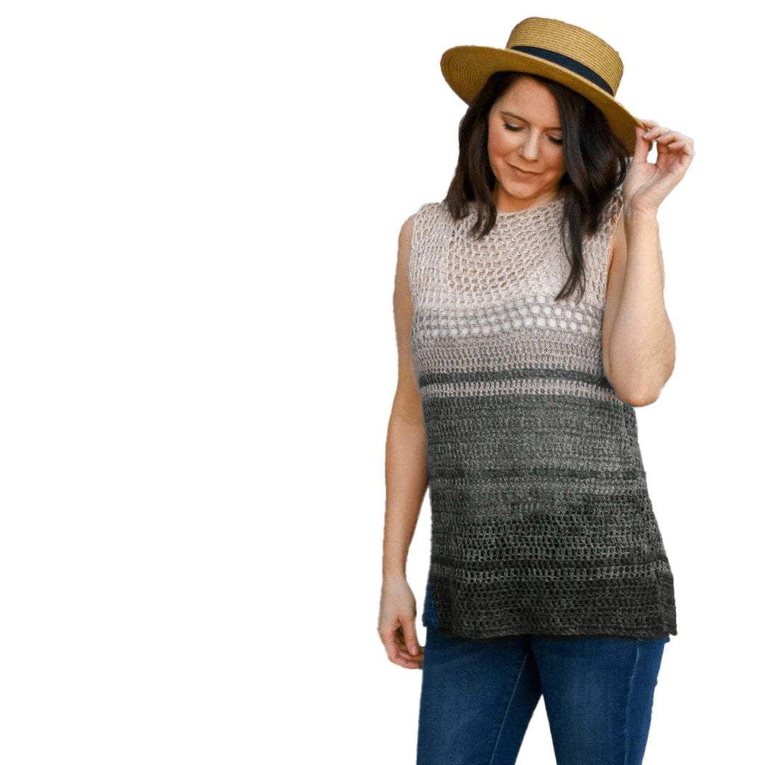 Easy breezy crochet top in colorway stormy night in front of a white background.