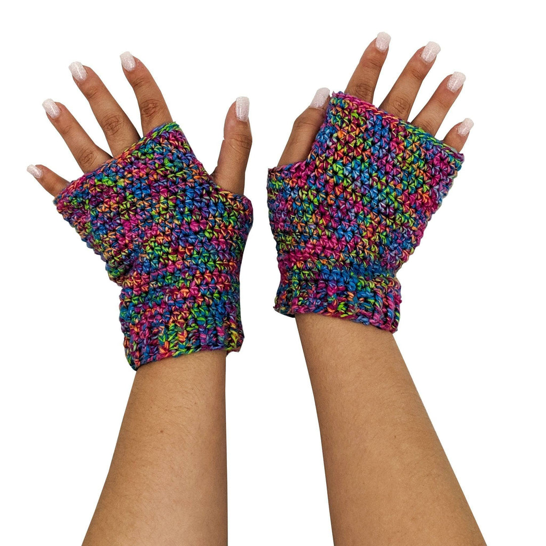 2 hands wearing crochet version of Easy fingerless mitts in Dragon's tail in front of a white background.