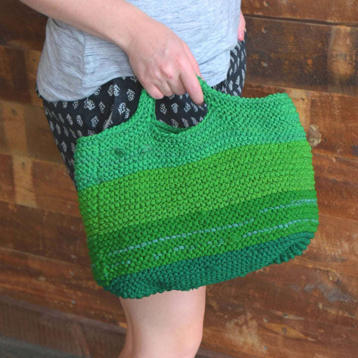 knit version of green jungle reclaimed chiffon ribbon market tote with wood in the background.