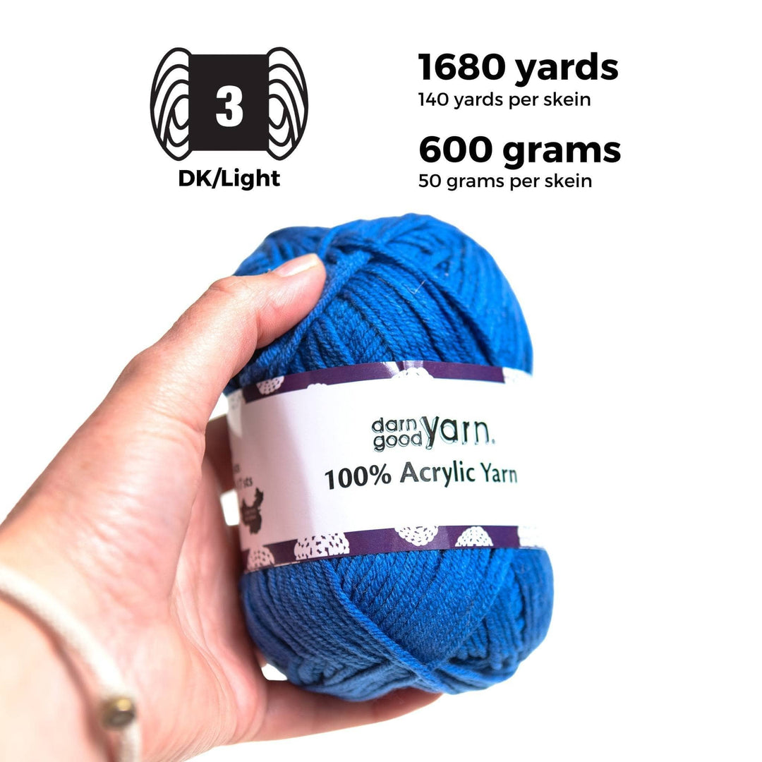 Hand holding one skein of 100% acrylic blue yarn. Graphics and text at top read: Weight 3, DK/Light. 1680 yards total, 140 yards per skein. 600 grams total, 50 grams per skein.