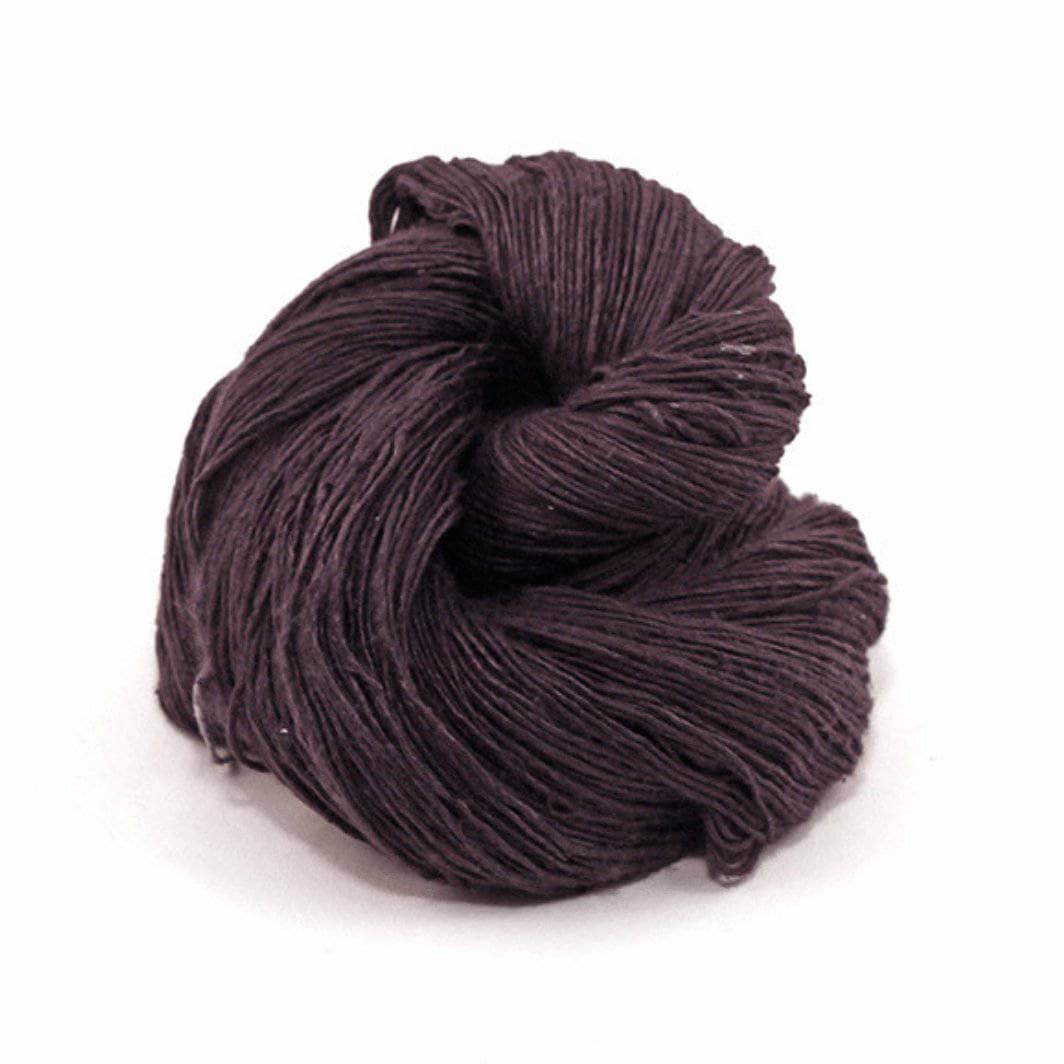 brown cake of yarn in a white background