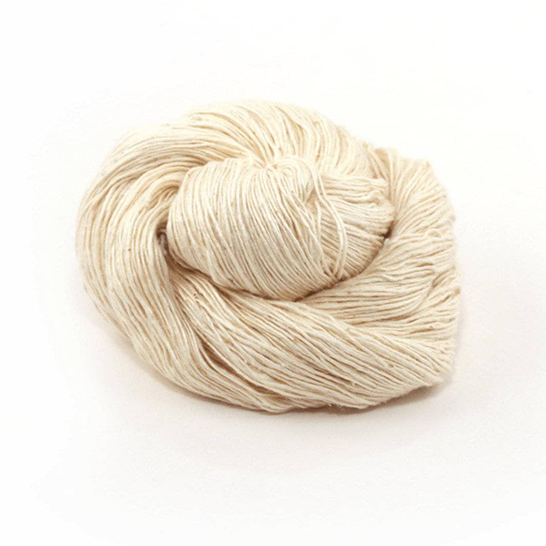 white cake of yarn in a white background