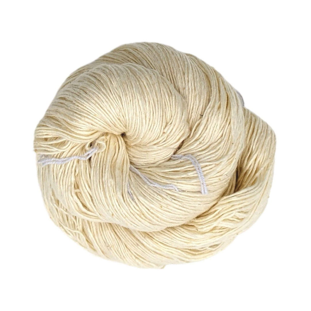 dyeable undyed ecru white lace weight silk yarn in front of a white background. 