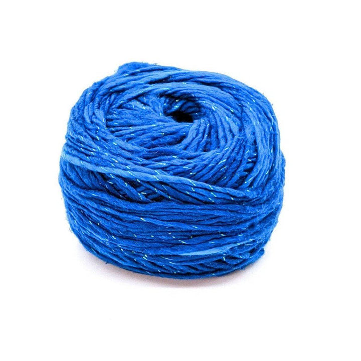 A cake of sparkle blue yarn on a white background
