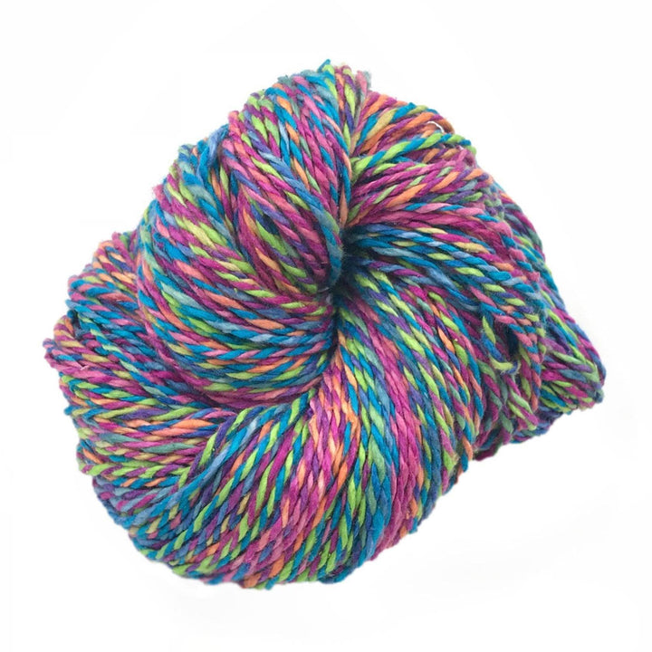 multicolored cake of yarn in a white background