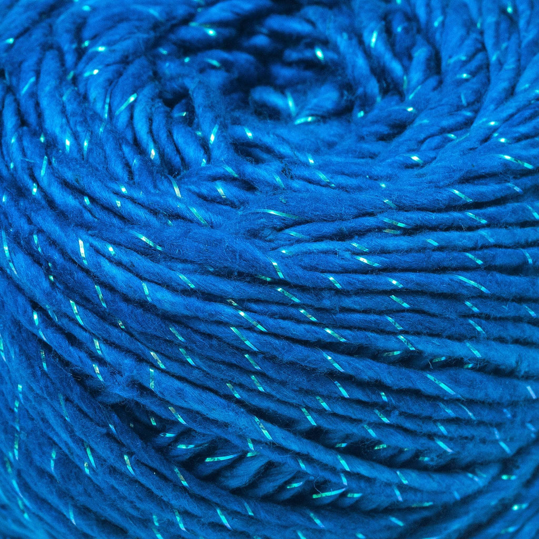 Close up image of silk roving worsted weight sparkle classic blue to show yarn detail.