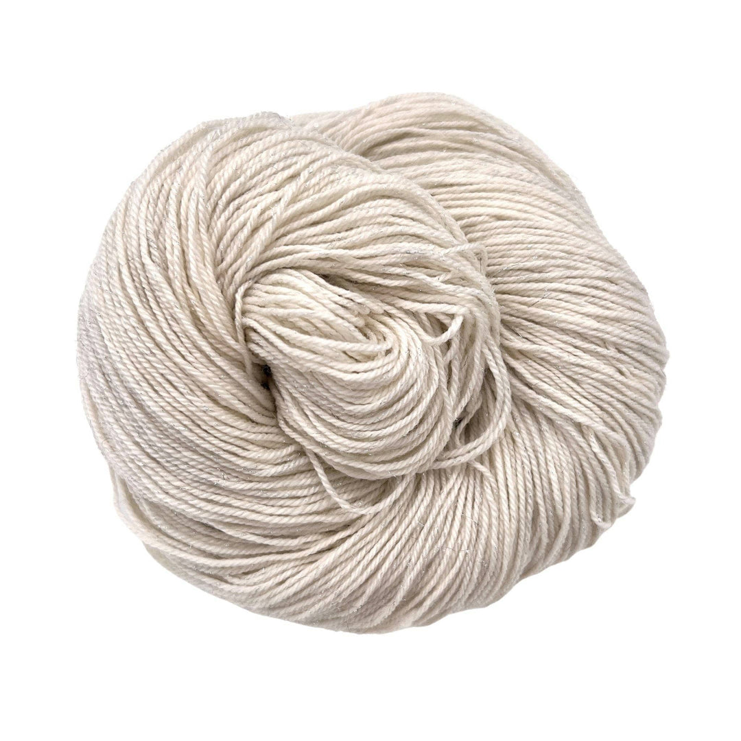 Cream colored yarn on white background