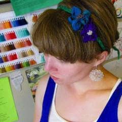 close up of a woman wearing a Flower Headband