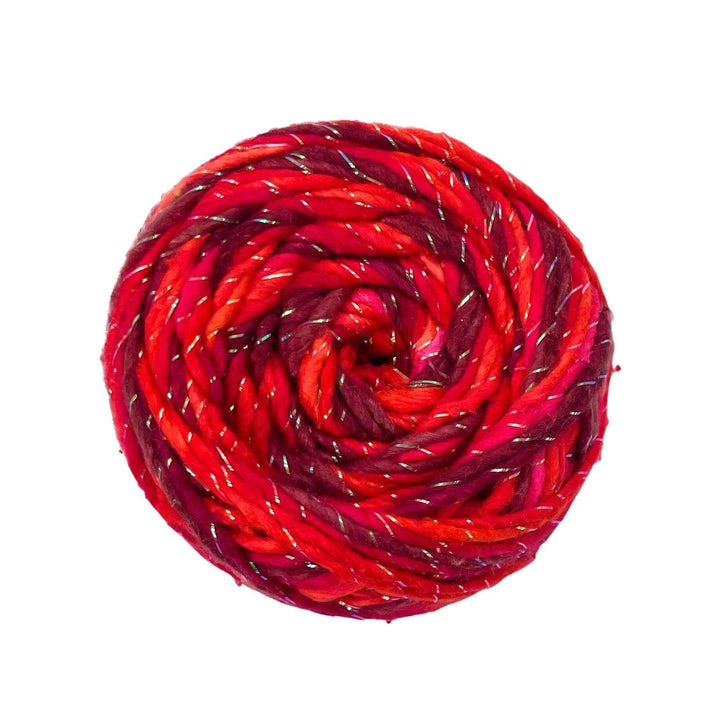 skein of 3 shades of red and sparkle on a white background