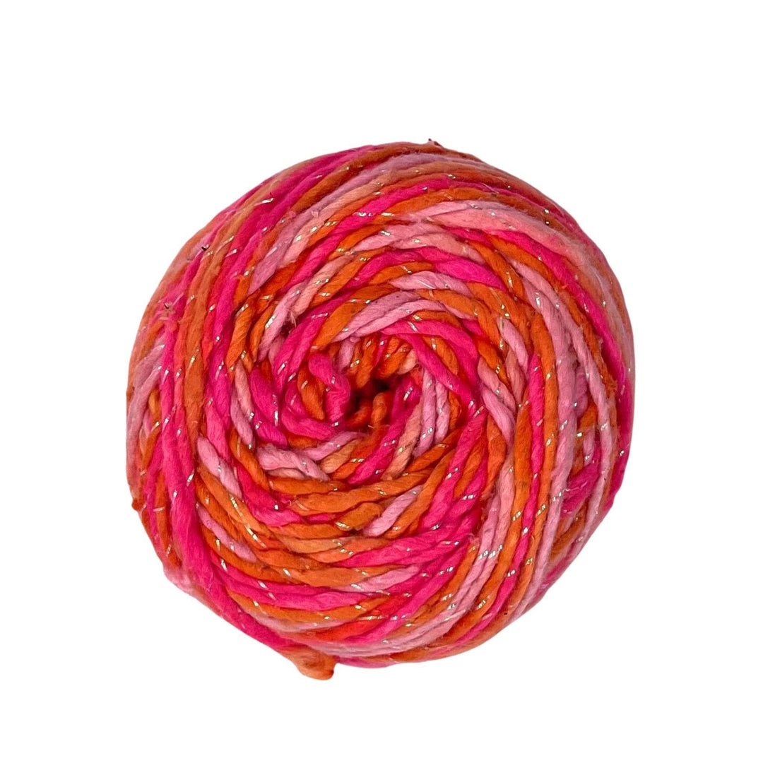 A skein of 5 shades of pink and sparkle on a white background