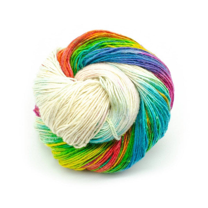 skein of white and rainbow lace weight yarn in front of a white background.