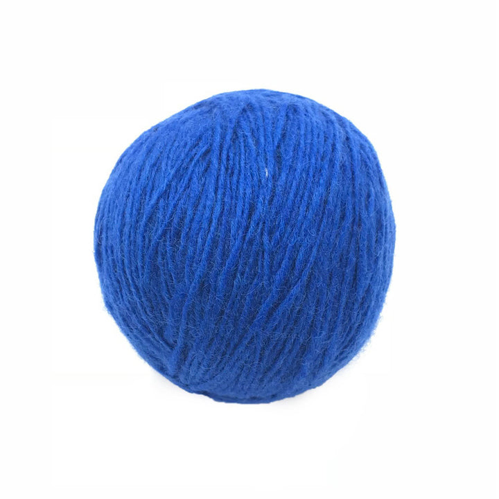 blue yarn cake over a white background