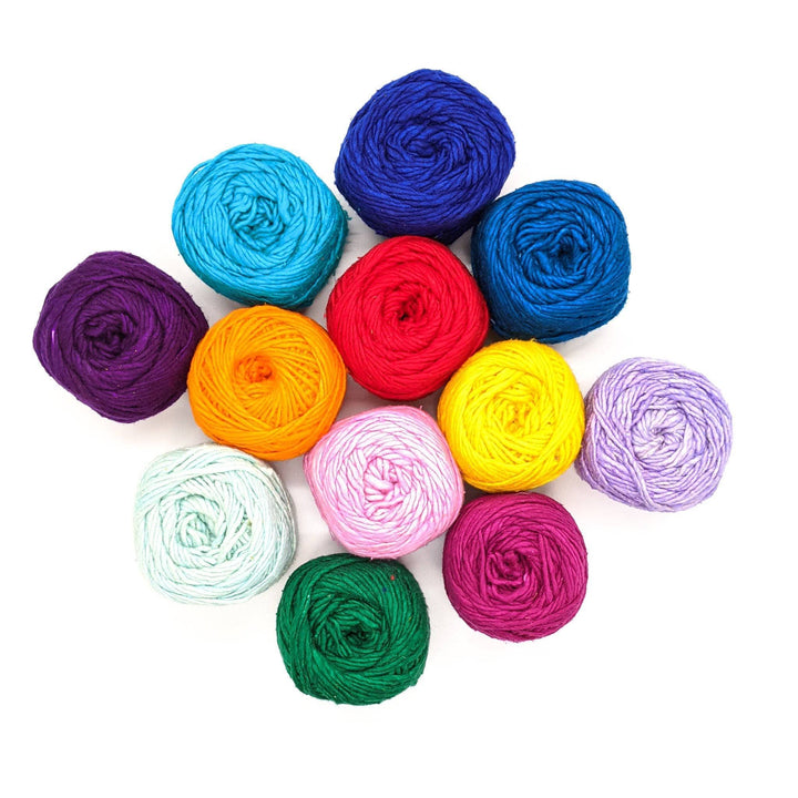 12 cakes of silk roving worsted weight silk yarn in 12 colors, arranged in a diamond in front of a white background.