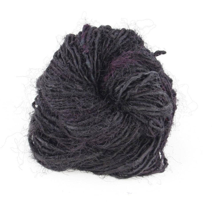 Handspun Sport Weight Recycled Silk Yarn over a white background