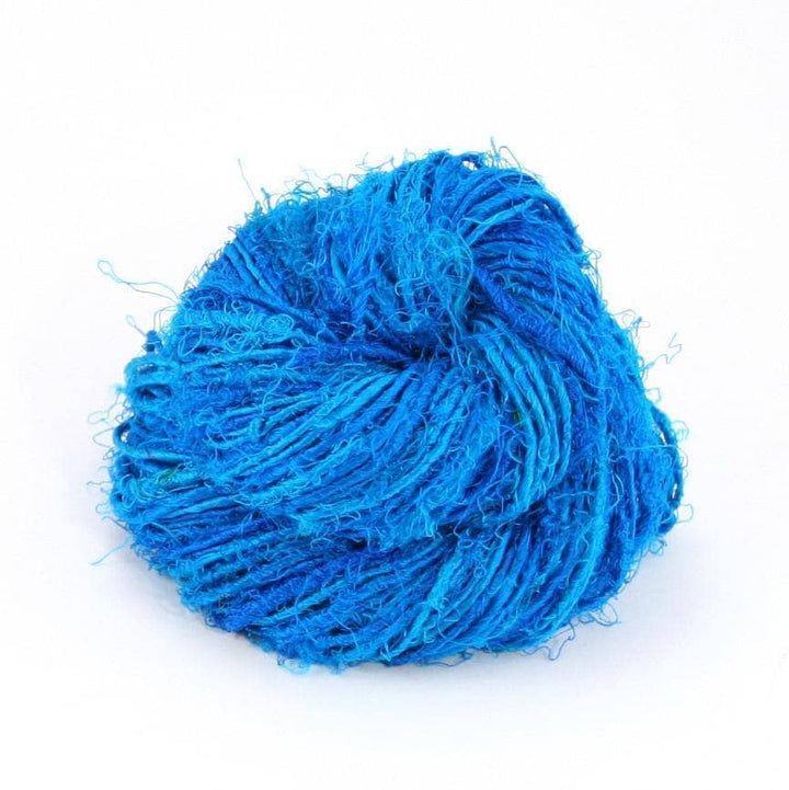 Handspun Sport Weight Recycled Silk Yarn over a white background