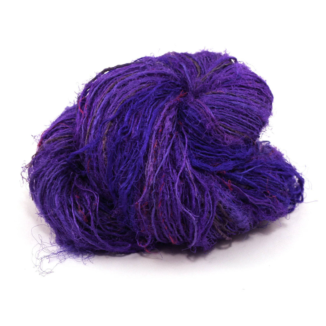 Handspun Sport Weight Recycled Silk Yarn over a white background