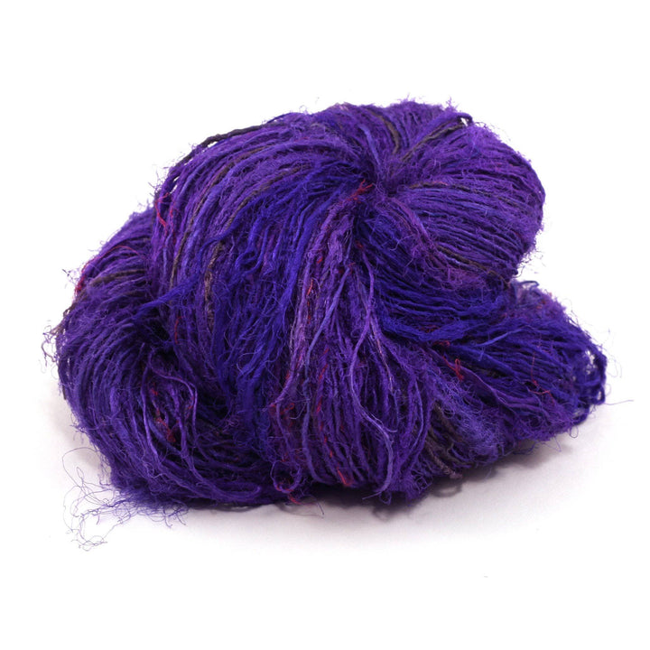 Handspun Sport Weight Recycled Silk Yarn over a white background