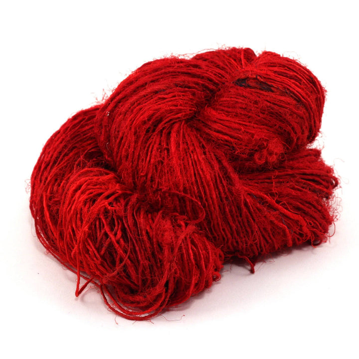 Handspun Sport Weight Recycled Silk Yarn over a white background