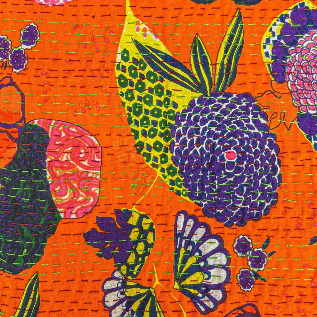 Closeup of orange symphony  kantha quilt pattern. 
