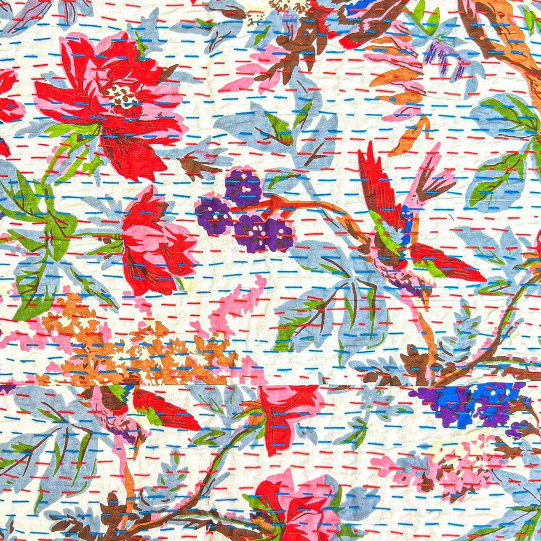 Closeup of vibrant rainforest kantha quilt pattern.
