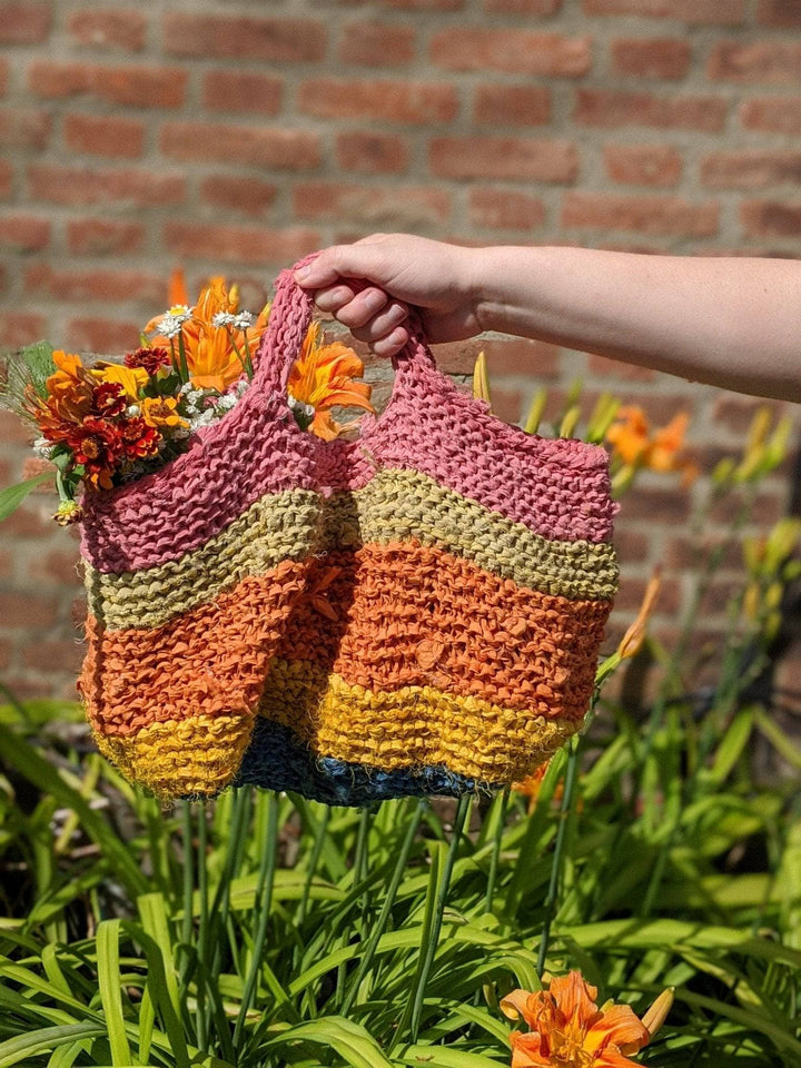 a colorful bag being held outside