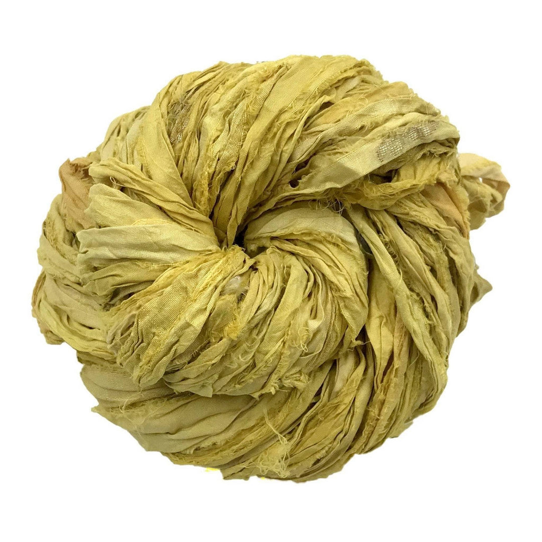Single skein of sari silk ribbon yarn (yellow) in front of a white background
