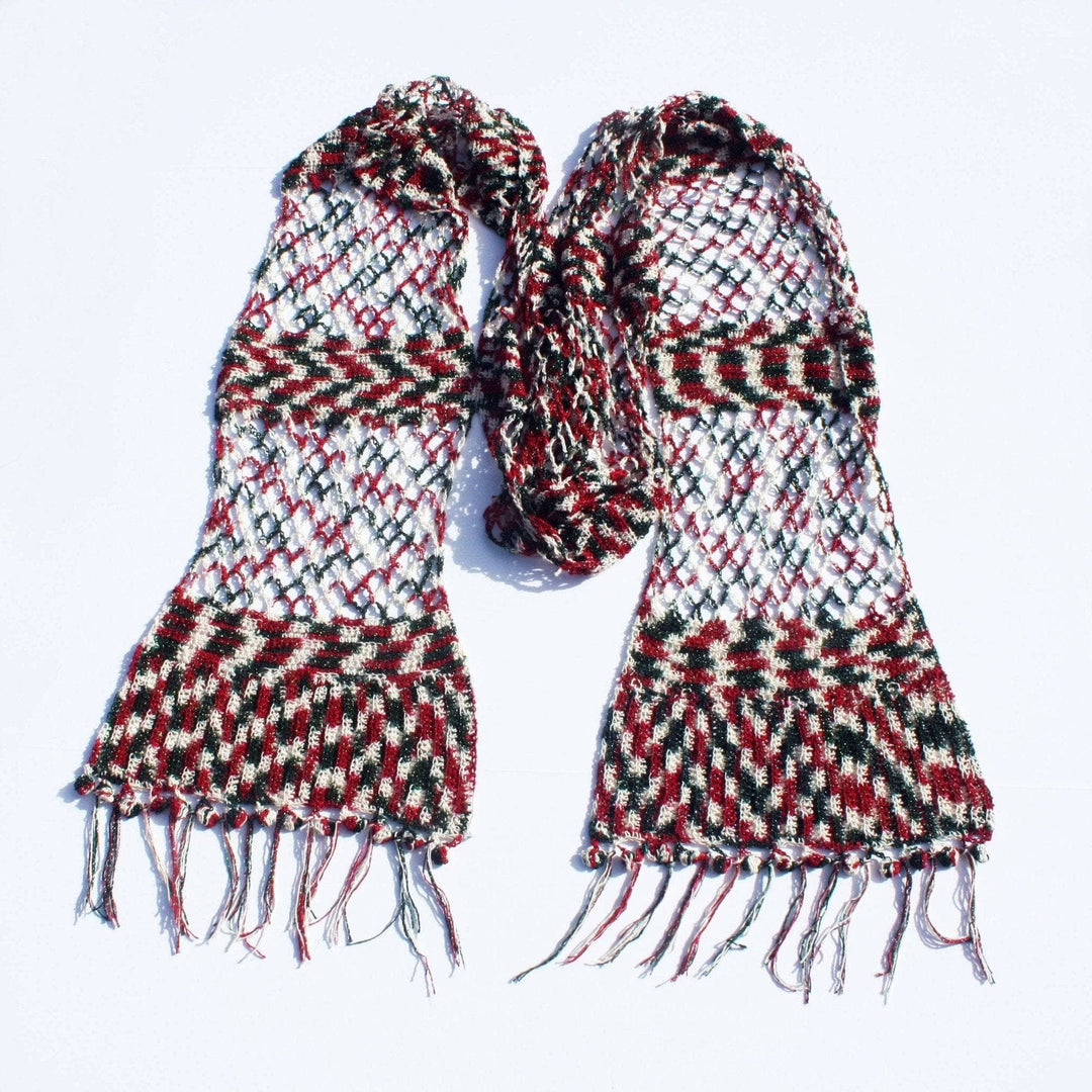 A red, green and white sparkle scarf on a white background