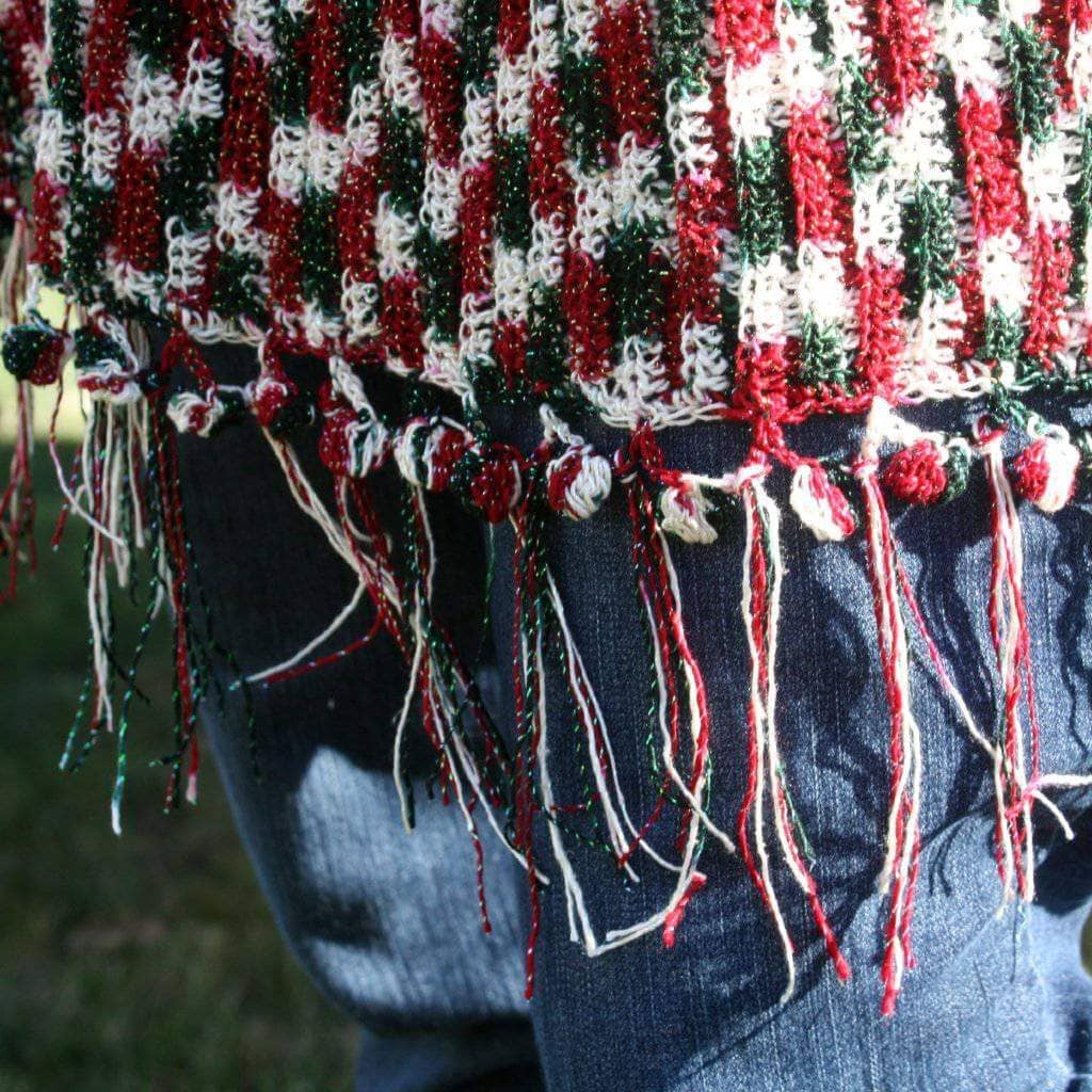 green, red and white scarf on a white background