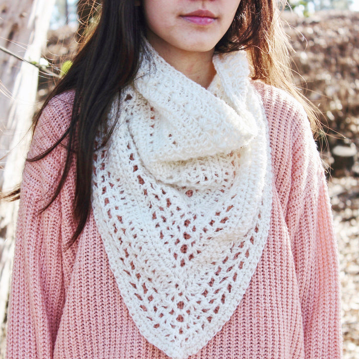 Woman wearing The Calla Cowl Bandana in white and a pink sweater