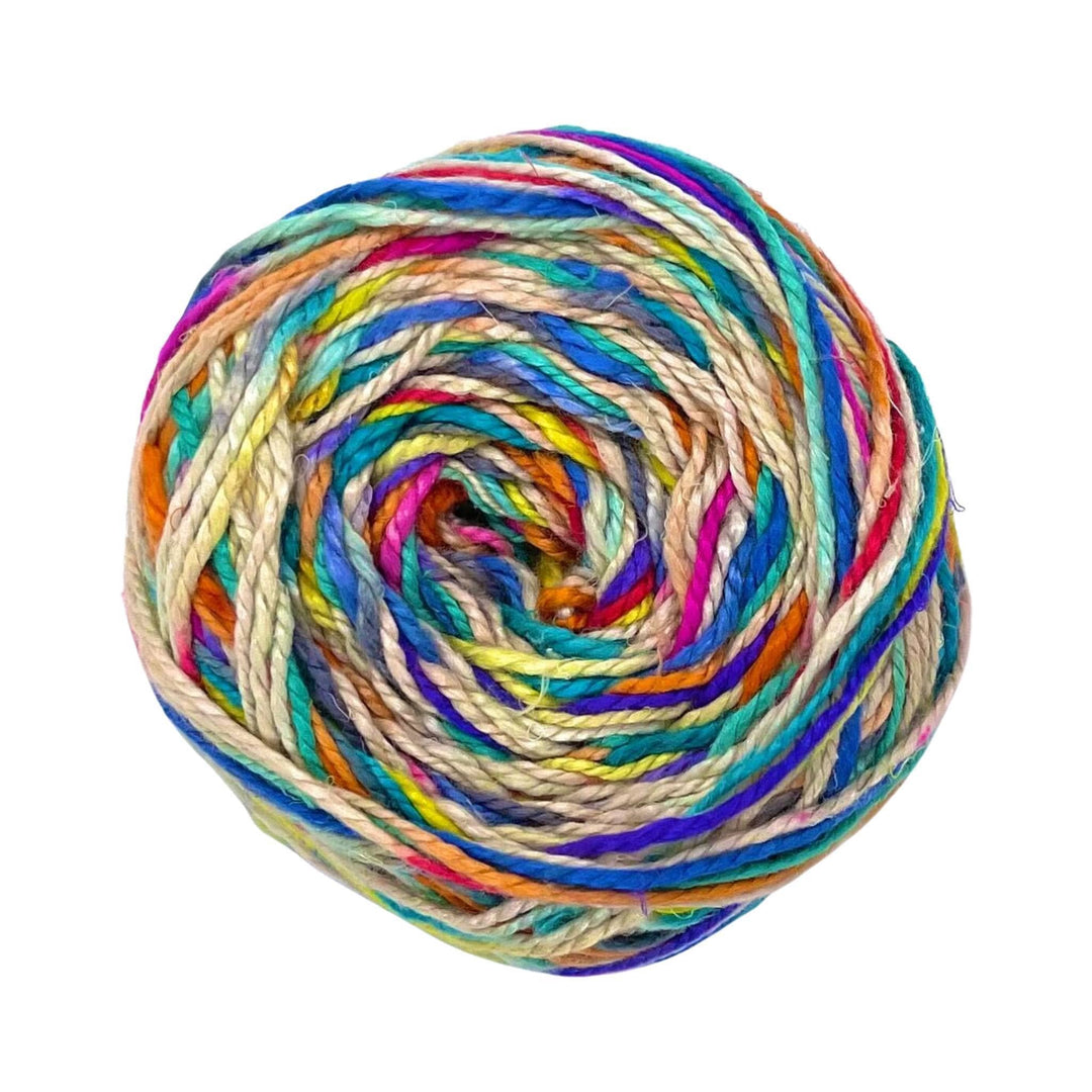 A skein of white yarn with a multicolored sections