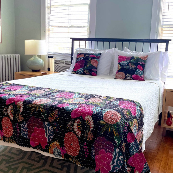 Night lily Kantha Quilt and Pillow Cover Set on a white bed set. 