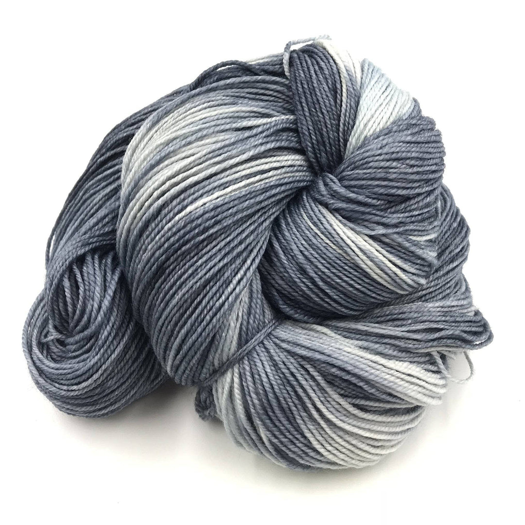 Superwash merino wool sock yarn ball in Elegant Gray on a white background