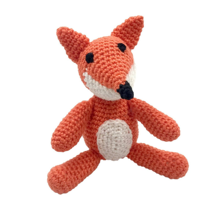 completed fox crochet amigurumi in front of a white background.