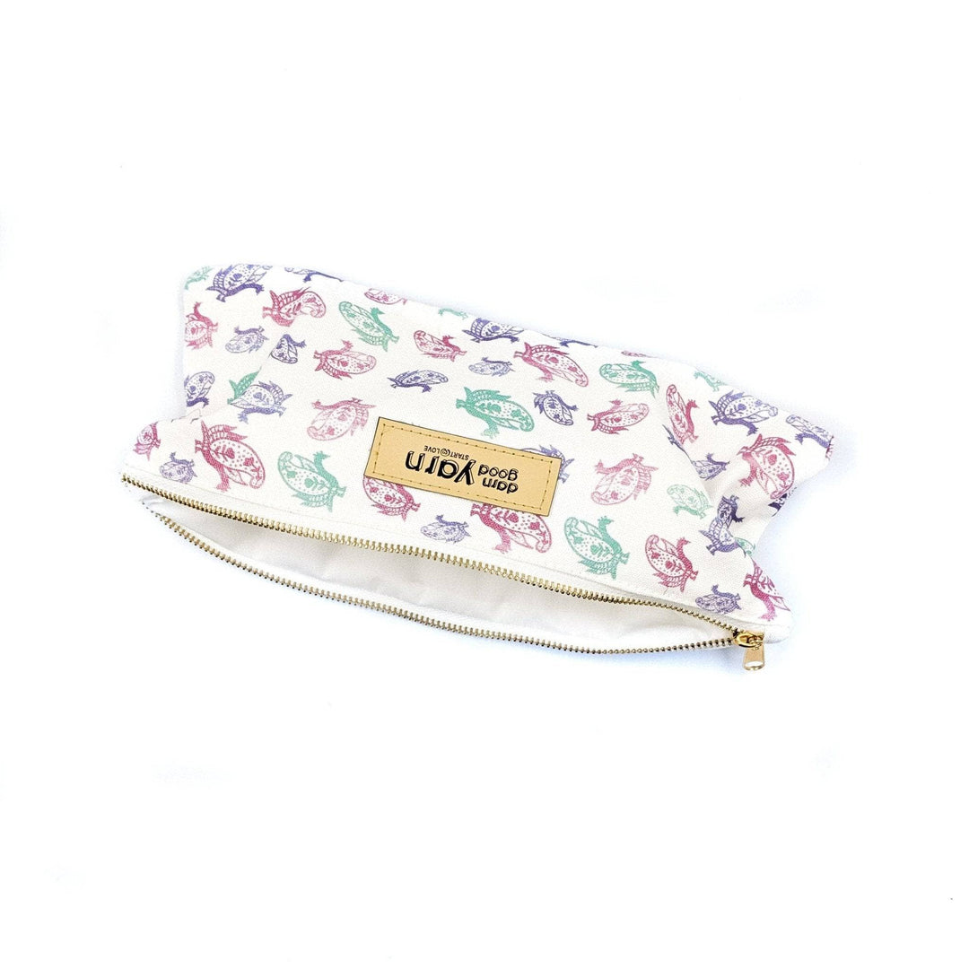 Unzipped Multicolored paisley bag on a white background 