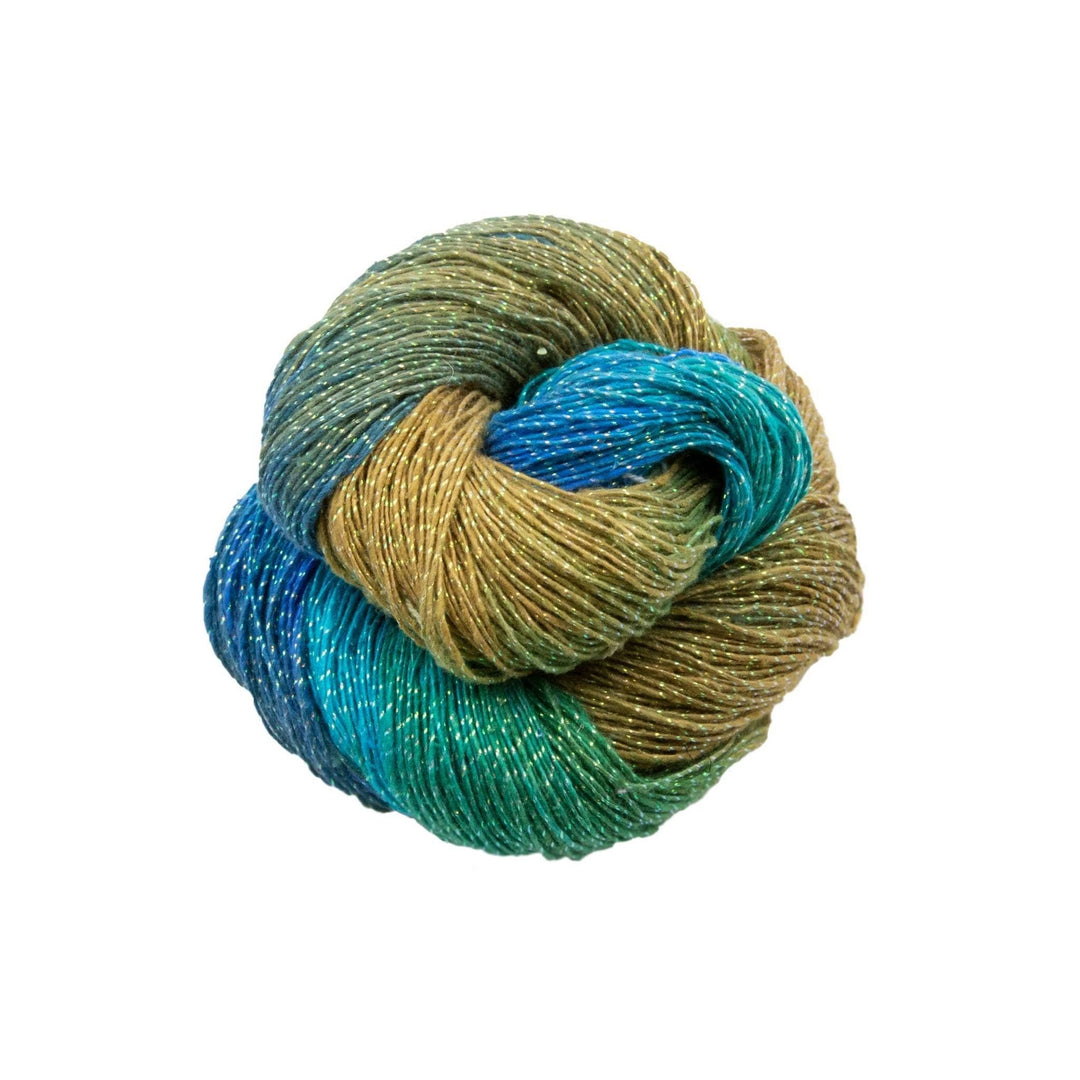 Lace weight silk yarn in color way Sparkle Sandy Beach (moss green, blue and turquoise) in front of white background.