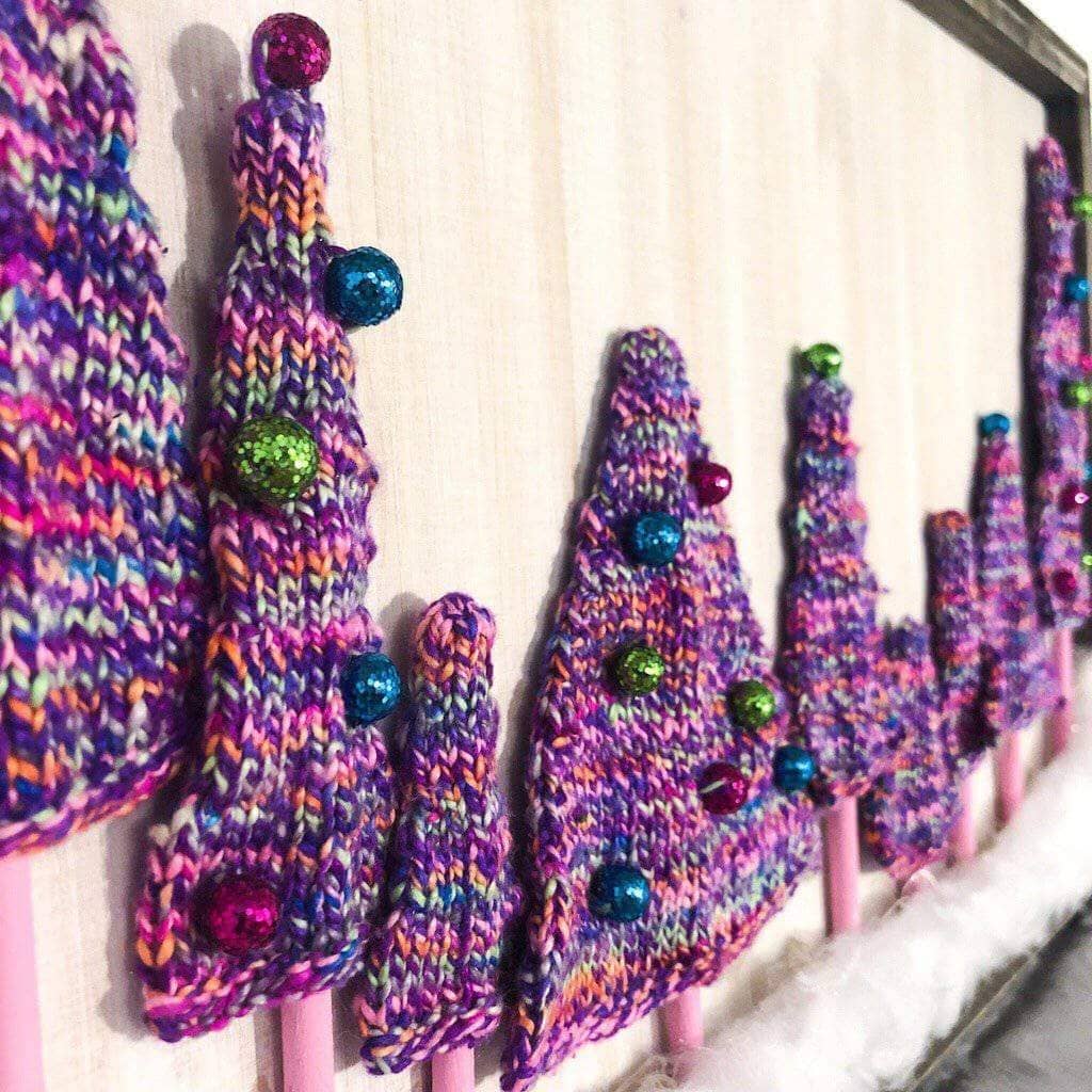 Purple yarn trees on a white background