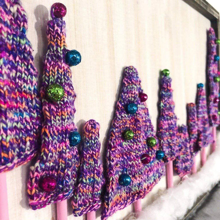 Purple yarn trees on a white background
